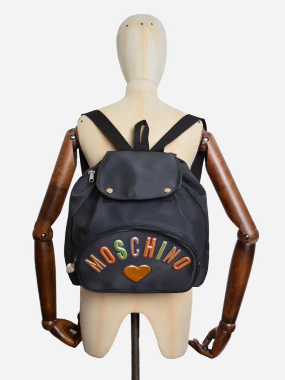 1990's Vintage Moschino Black Backpack with Multicolor Lettering and Gold Heart